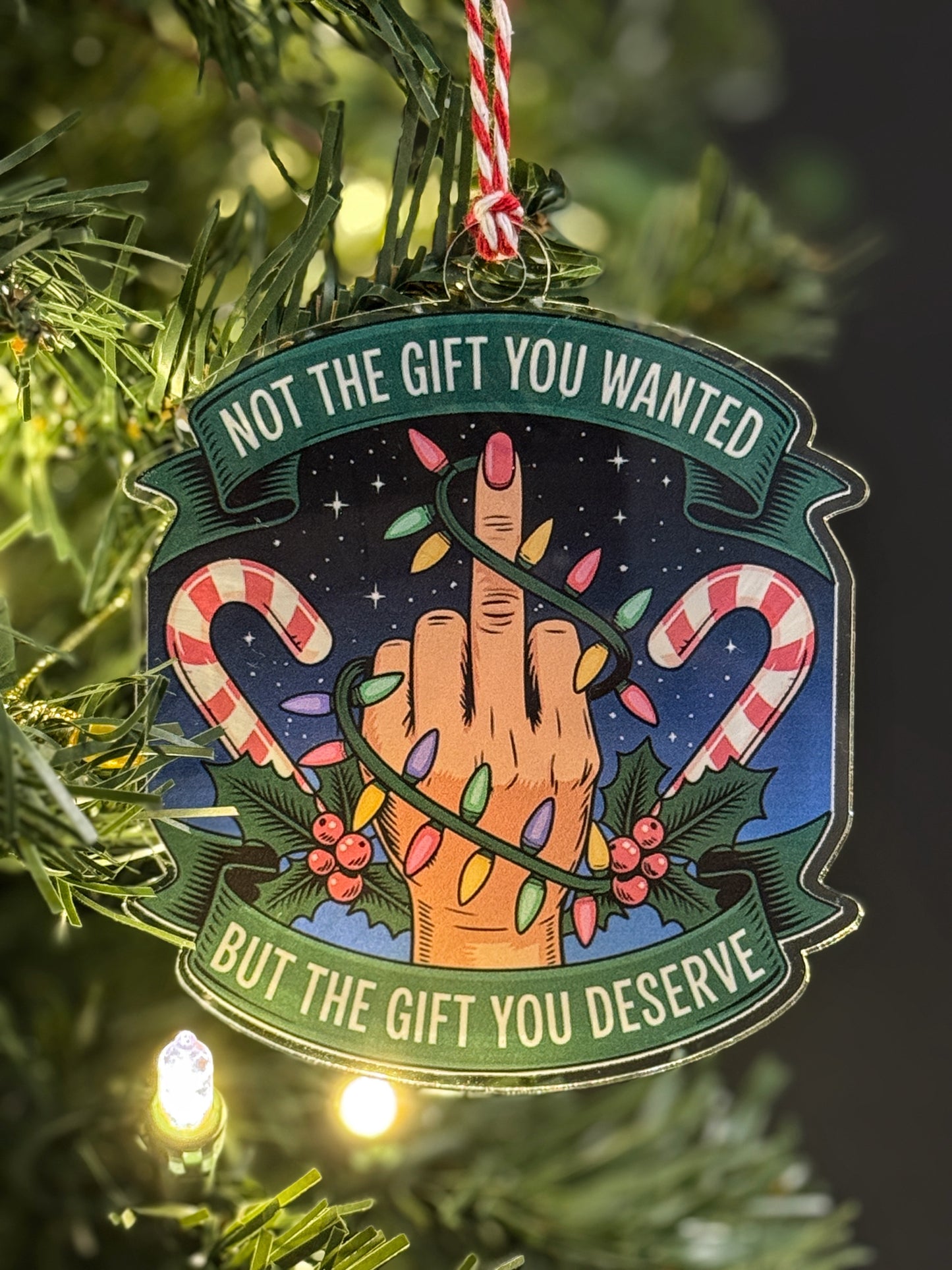Middle-finger gag Christmas ornament — alternate view