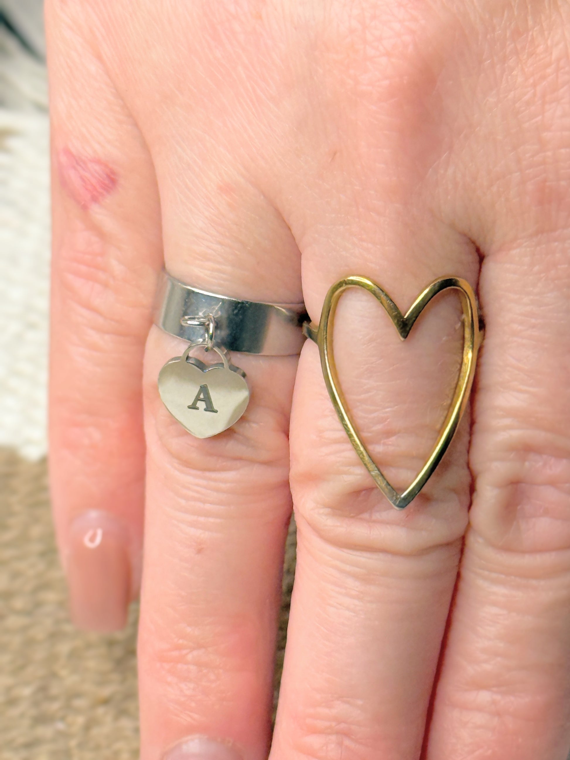 Dangling heart adjustable ring on hand