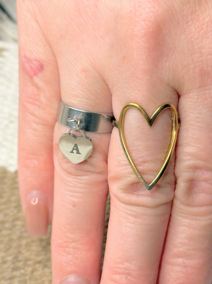 Dangling heart adjustable ring on hand