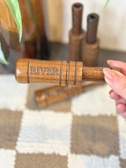 Engraved wood duck call — detail view