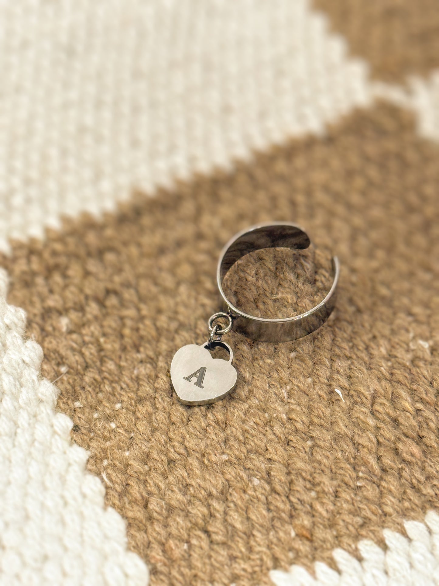 Dangling heart ring with adjustable band