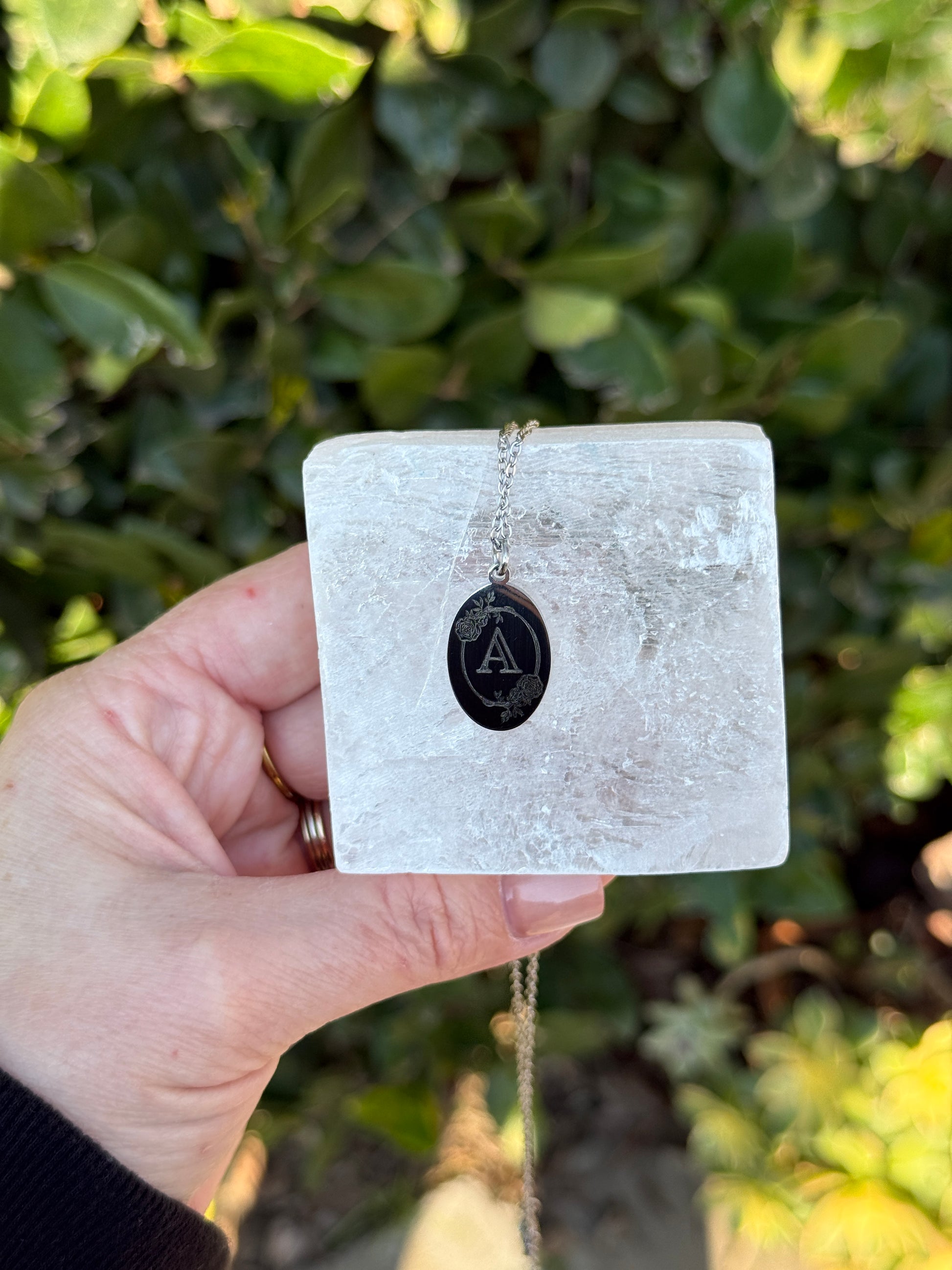 Oval charm pendant — engraving detail