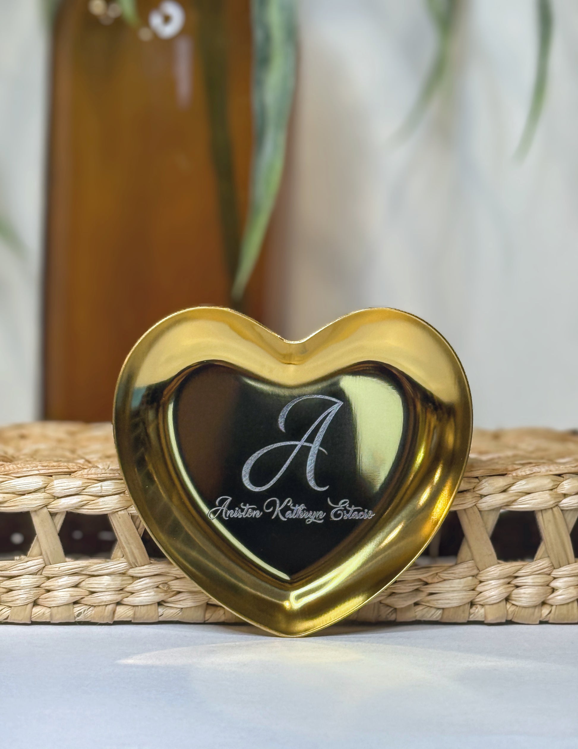 Heart trinket tray styled with rings and jewelry — laser-engraved personalized jewelry dish from The Burn Shack