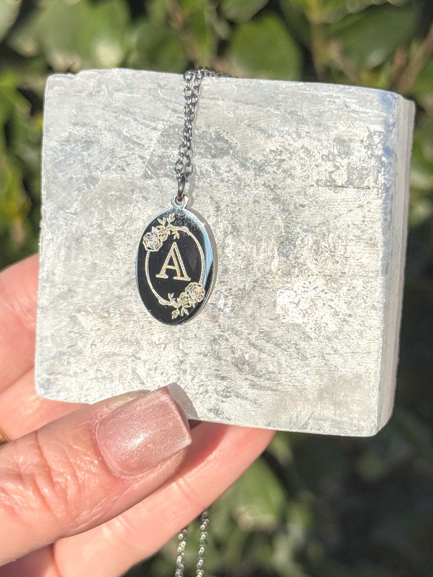 Oval charm necklace — gold finish detail