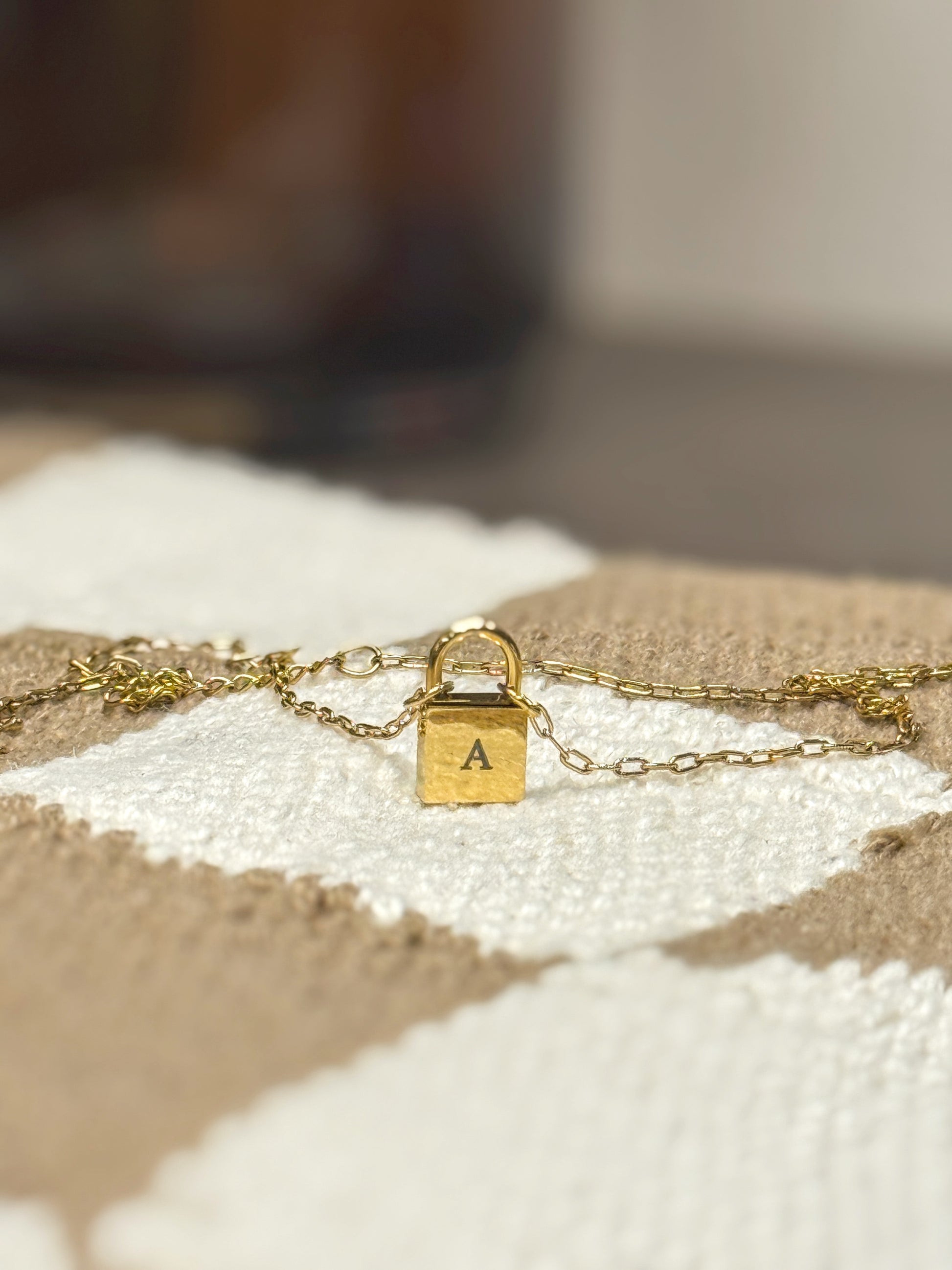 Dainty lock necklace — close-up detail