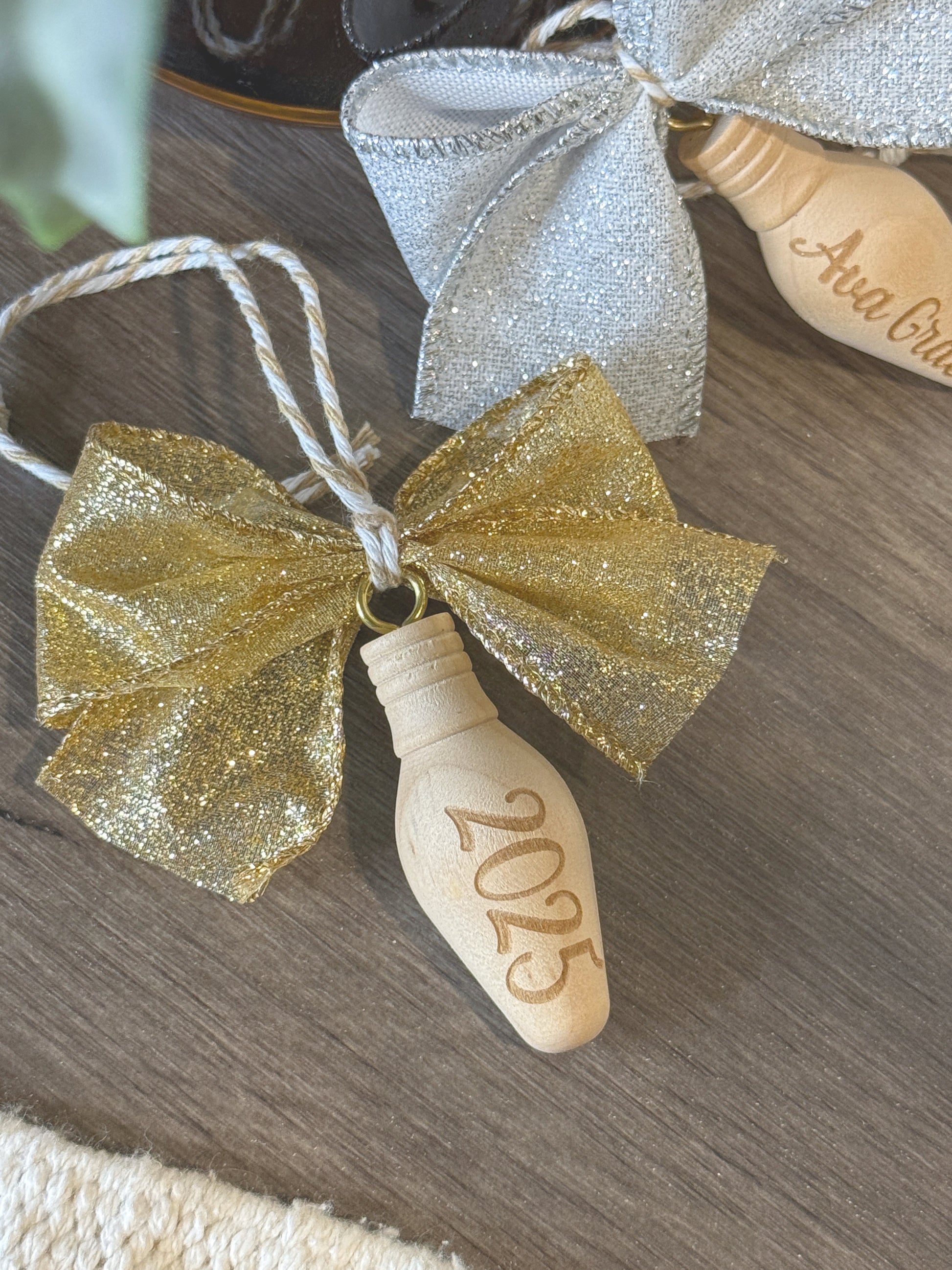 Wood Christmas bulb ornament hanging on tree