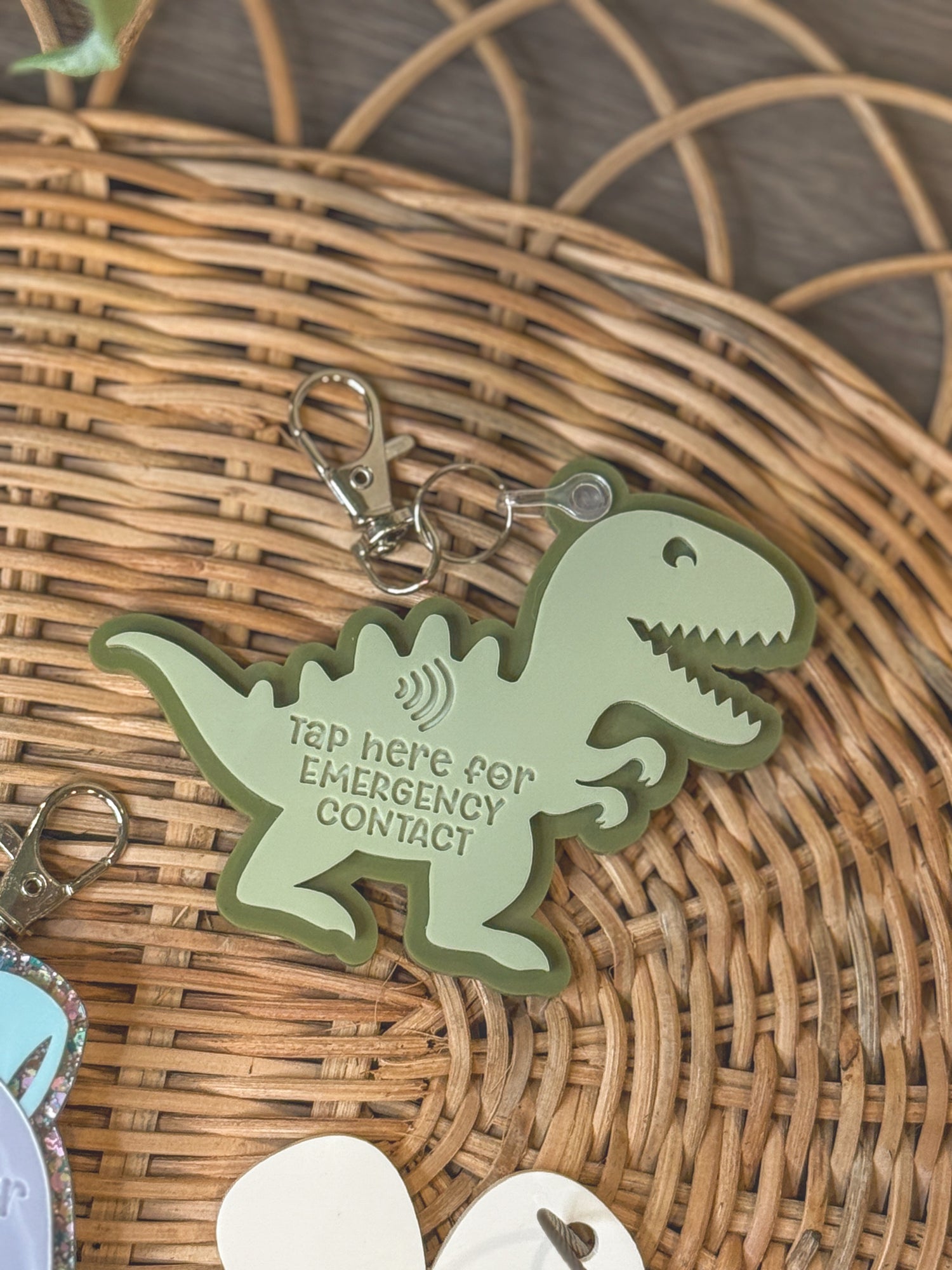 Dinosaur-shaped acrylic NFC backpack tag for kids with emergency contact info