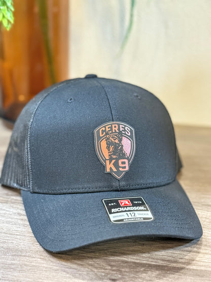 Logo leather patch hat — styled photo